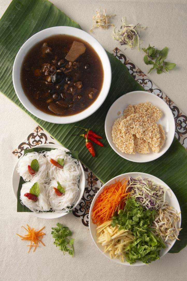 Lao noodles in caramelized beef broth with mushroom