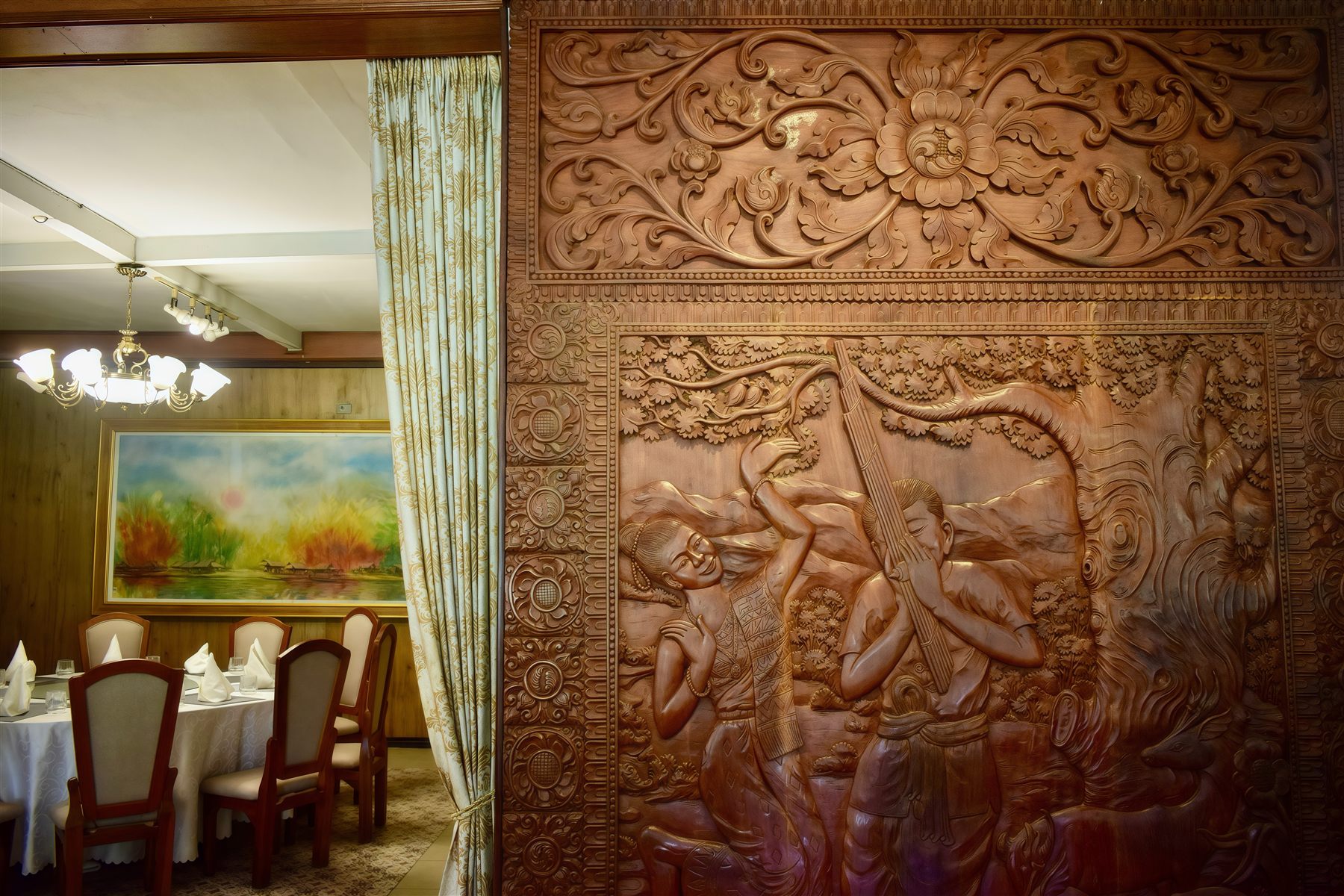 Detail of hand-carved wooden relief artwork