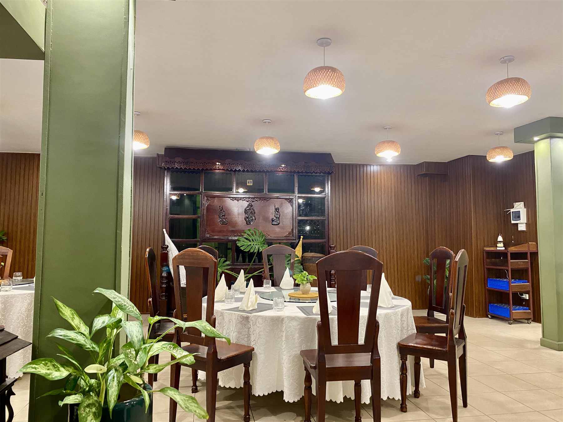 Dining room featuring traditional Lao wood carving