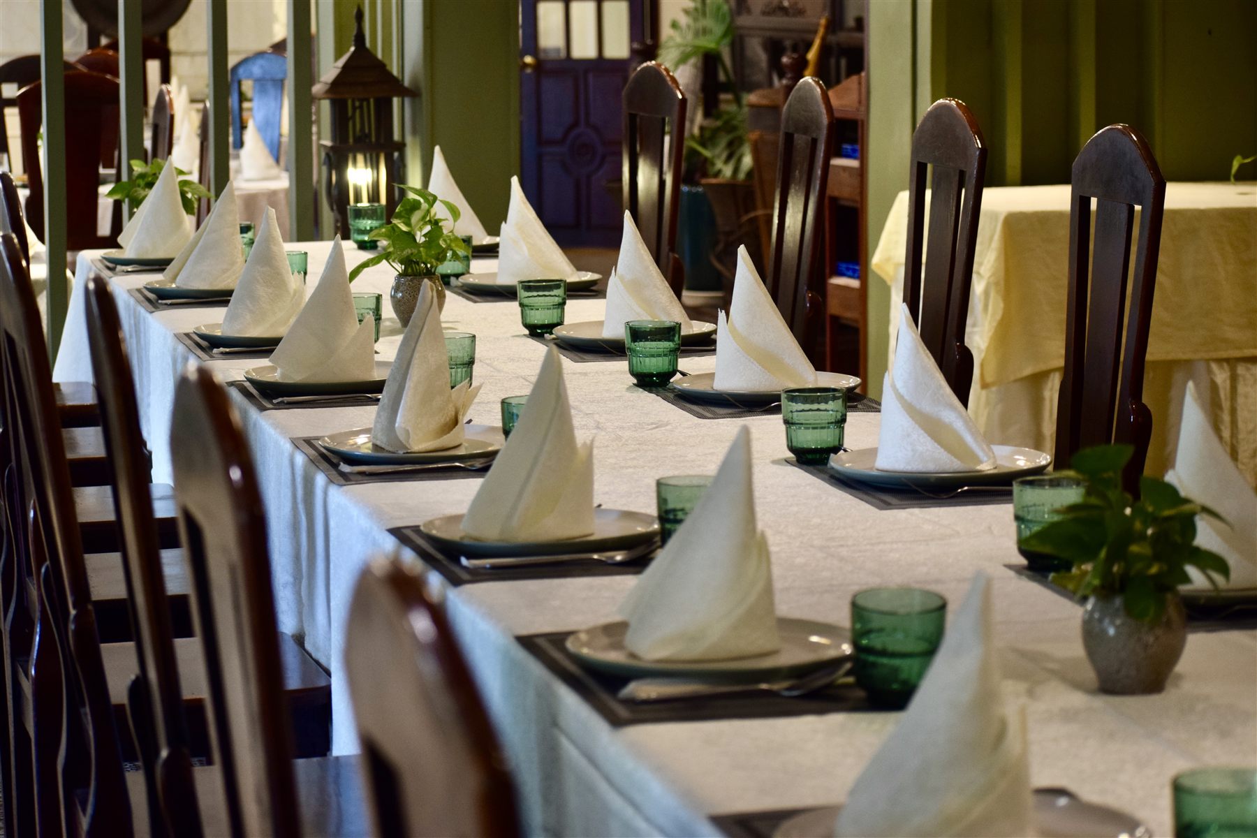 A long table set for a group dinner