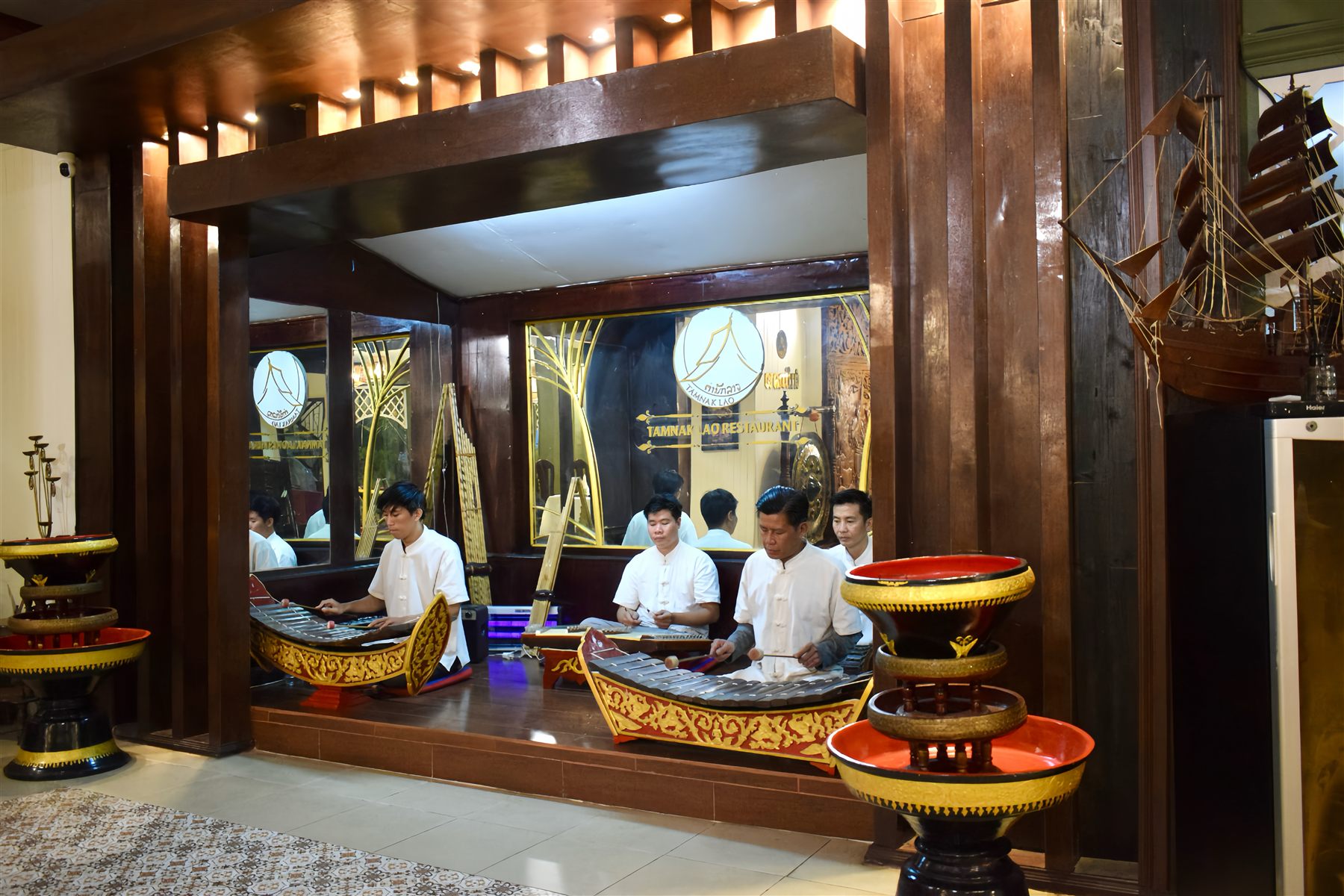 Traditional Lao musicians performing on the ranard xylophone